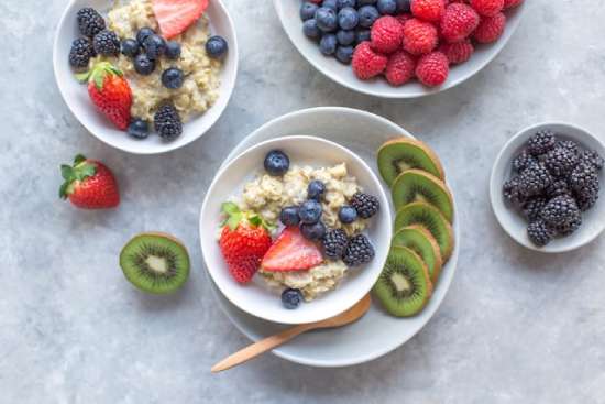 Oatmeal fresh whole fruit Bowls of oatmeal with fruit, a breakfast Adventists might have