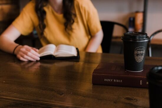 Woman reading Bible A woman reading her Bible and Ellen White's writings