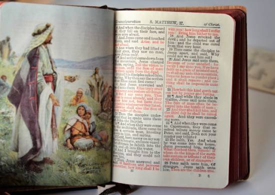 Bible Open to the Passage about the Demon Possessed Boy that Jesus Heals A Bible is open to Matthew's account of a demon-possessed boy whom Jesus healed.