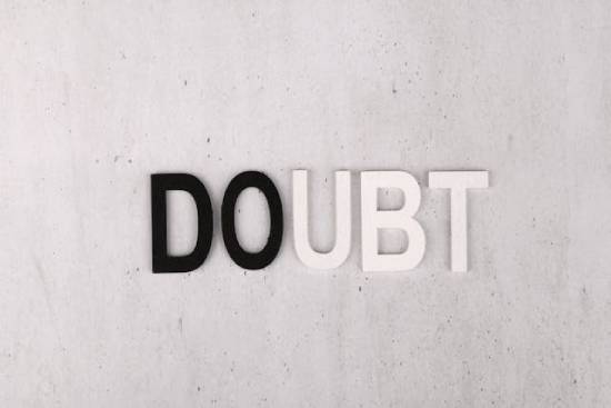 The word "Doubt" on a wall.