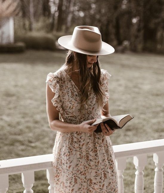 Modest Woman A modest woman reading a Bible