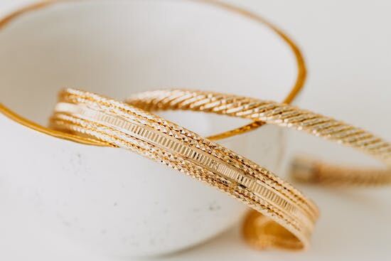 Gold Bracelets Gold bracelets in a white cup