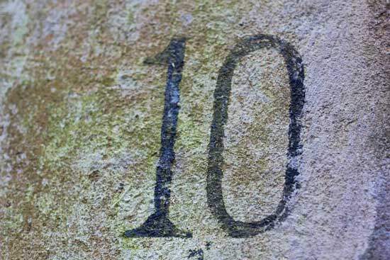 The number 10 engraved in stone, representing the Ten Commandments.