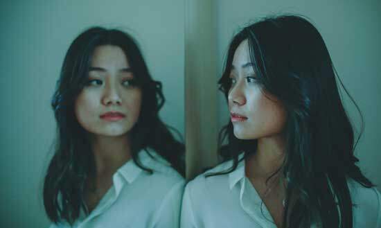 A woman looking in the mirror A woman looking in the mirror and contemplating her sinful nature