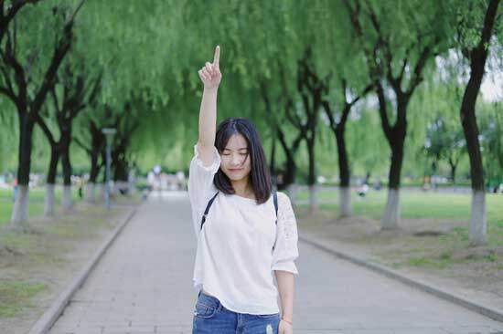 Girl pointing upward A girl pointing upward as she reflects on the first four commandments and the way they guide our relationship with God