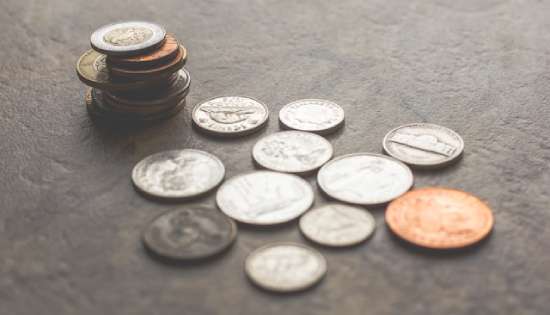Hands holding coins