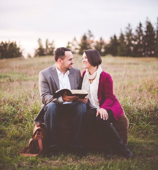 Married Couple Reading Bible A married couple reading the Bible together as they make Christ the center of their marriage
