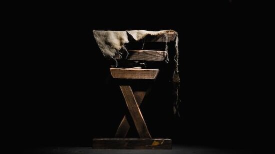 A side view of a wooden manger meant to represent where Jesus was placed after He was born.