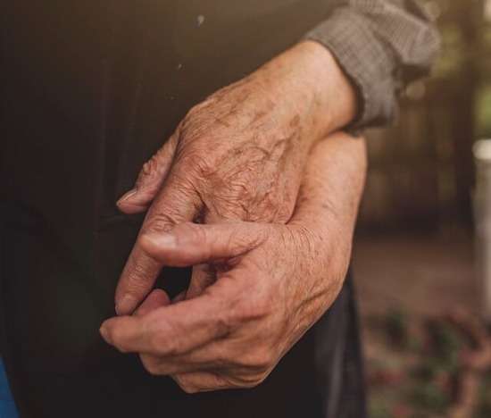 Old Hands Wrinkled hands of an older couple clasped together