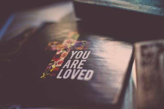 Book with a cross and the words "You are loved" on the cover A book cover with a cross and the phrase, "You Are Loved." God's love is the focal point of salvation.