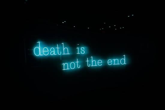 Neon sign that reads "Death is not the end" A neon sign reads