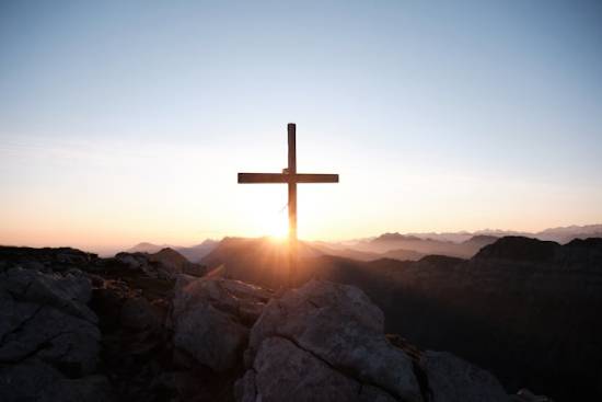 Wooden cross at sunrise A silhouette of a cross at sunrise, illustrating the beauty of the Gospel, which Paul's letter to the Galatians emphasizes.