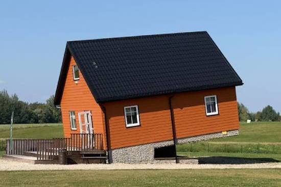 A house unnaturally sinks into the ground.
