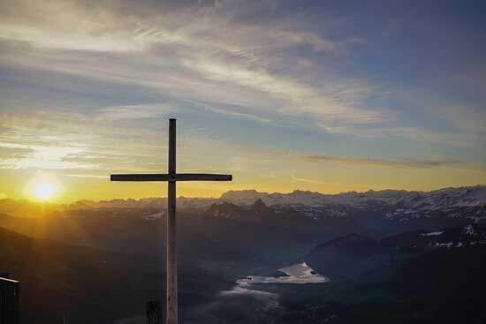 A cross set over a mountain range, highlighting how Jesus's sacrifice didn't abolish God's law, but instead empowers us to live by it.