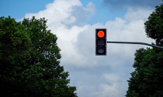 A red traffic light illustrates how God's law functions to warn us to act accordingly.