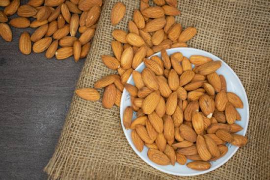 A plate of overflowing almonds.