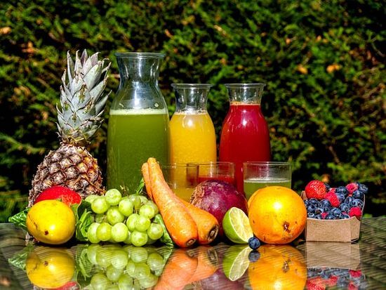 A variety of fruits and juices on a table Colorful fruit and vegetables for a healthy diet