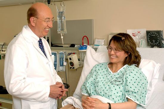 A Seventh-day Adventist doctor with a patient in the hospital