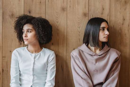 A table with bright green and colorful food that compose a vegetarian diet