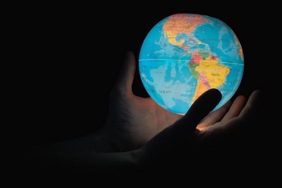 Hands Holding Illuminated Globe An image of hands holding an illuminated globe shows that the entire world will experience Christ's return at the same time. And it'll be so grand that all events on Earth will stop as the world watches the events in the sky unfold.