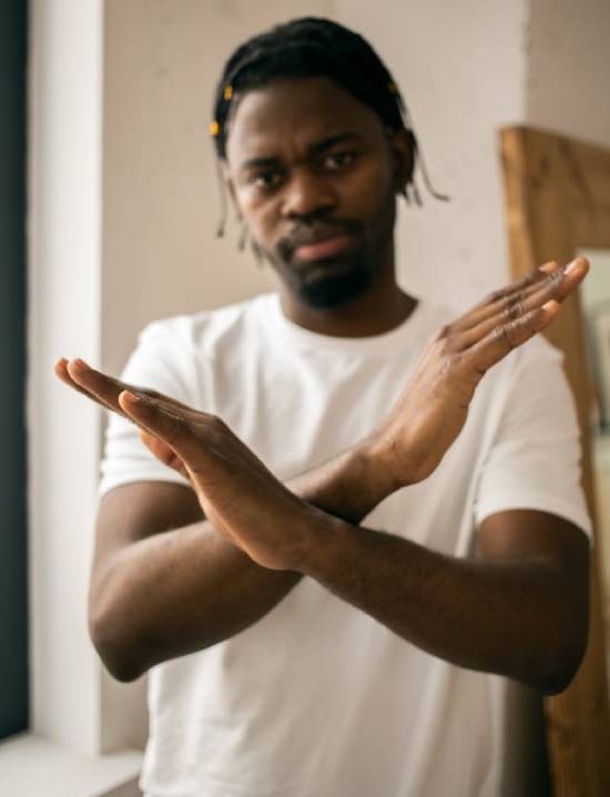 Man Crossing Arms The image of a man crossing his arms in from of him like an X represents those who don't choose Jesus, and wouldn't be happy in Heaven. Though Jesus wants to take all God's children home, He gives us the freedom of choice.