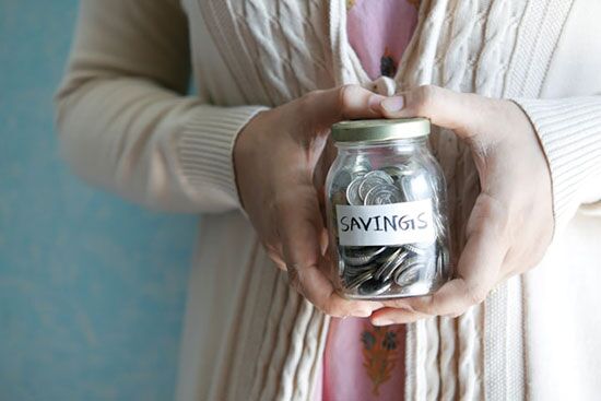 An image of hands hold a jar of change labeled "savings," demonstrates how we're stewards of God's resources. 