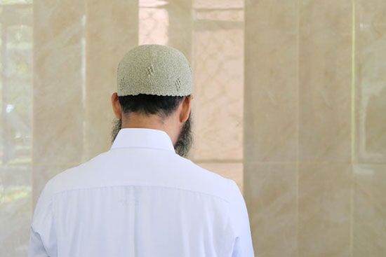 Muslim man in worship A Muslim man worshiping on Friday, the Muslim day of rest