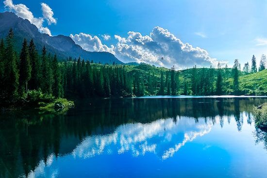 Blue lake A deep blue lake with mountains, the beautiful things God created before resting on the Sabbath