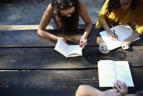 Three Adventist Students Studying Outside 3 Students under the Adventist Education system studying their courses in the context of the plan of redemption