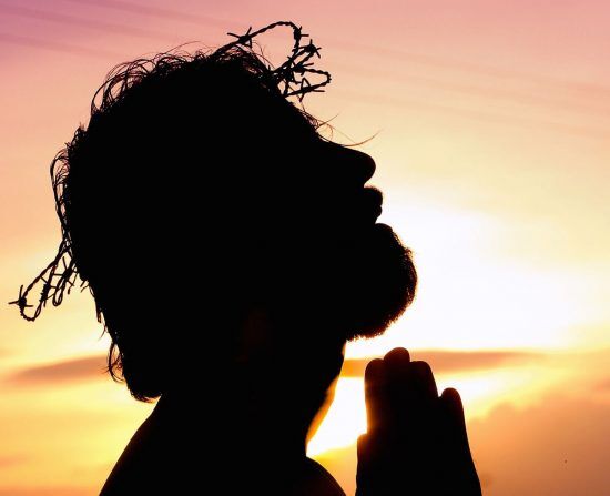Silhouette Jesus Christ Silhouette of Jesus Christ with a crown of thorns on His head as He came to conquer evil