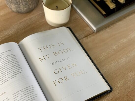 An open Bible with the verse,
