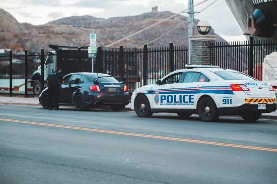 Police Pulling over Speeding Driver Police car pulls over a speeding driver, as he pleads for mercy & grace, in analogy on how law & grace apply in our lives