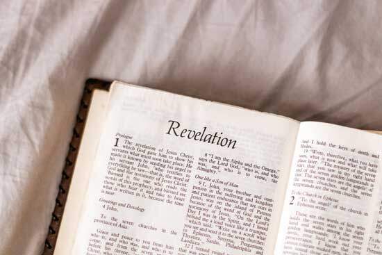 Book of Revelation A Bible open to Revelation, which contains the three angels' messages that the remnant has been called to proclaim