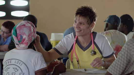 Christian missionary A Christian missionary following the example of Jesus by meeting the physical and medical needs of a person