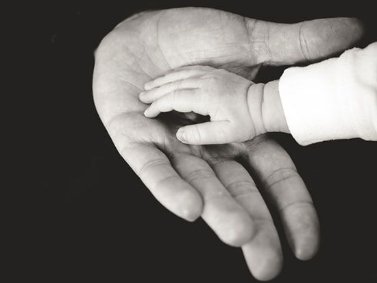 Hand of a child into the palm of his father Hand of a child into the palm of his father, as we study the life of Joseph, a favorite son of his father Jacob.