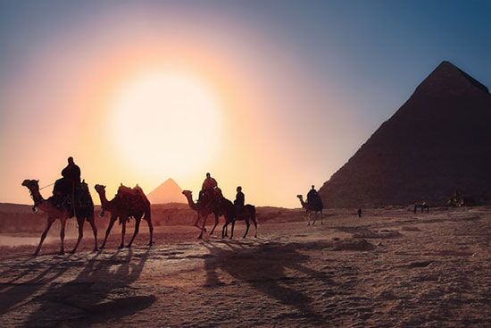 Travelers in Egypt Travelers on camels before pyramids of Egypt as we discuss mosaic or ceremonial laws given to Israelite in the wilderness.