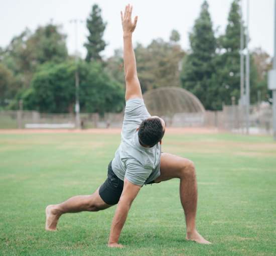 Man Doing Exercise A man stretches for his daily exercise routine.