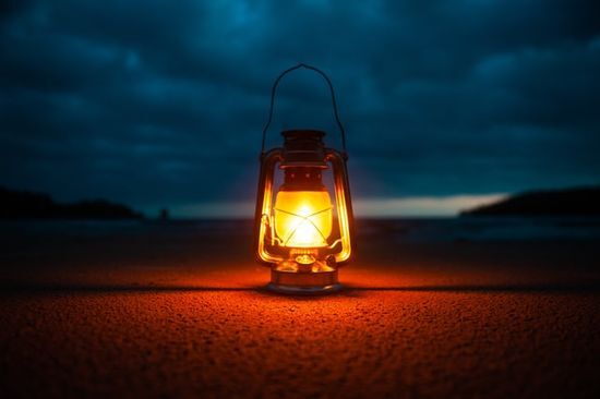 An oil-lamp shining in the dawn A lamp to remind us of Jesus' teaching to be a light to the world