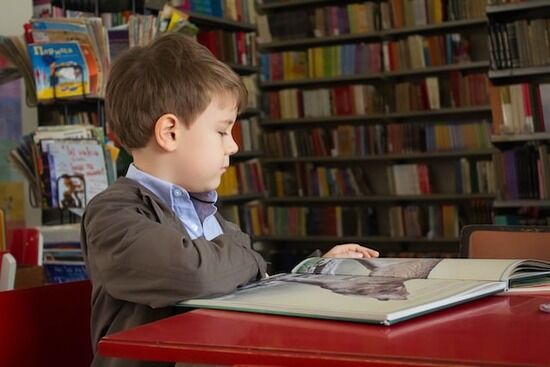 Boy reading A little boy reading a children's Bible story book from an Adventist Book Center