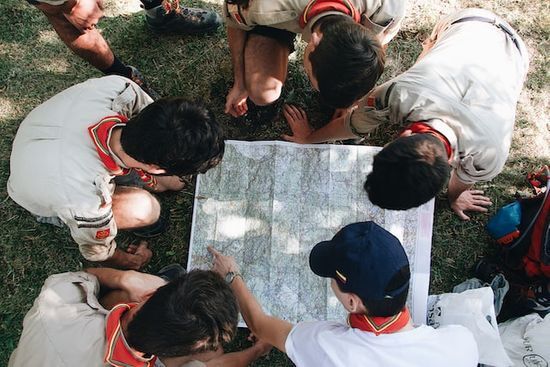 Looking at map Adventist young people looking at a map for an activity