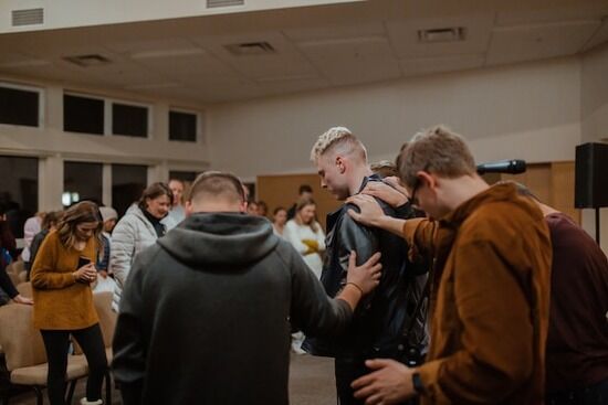 Canvassers Pray A group of colporteur evangelists gathering together to pray for one another