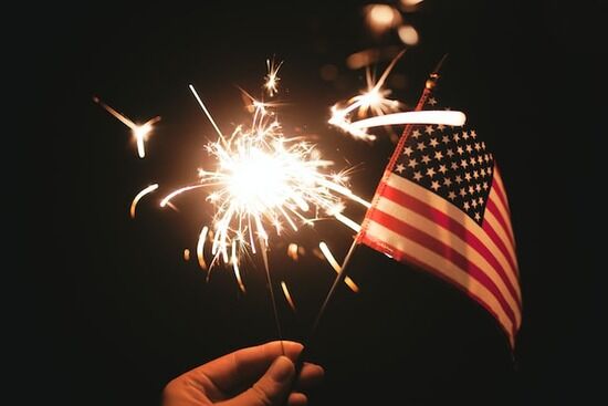 An American Flag An American flag with fireworks in the background to represent the patriotic holidays Adventists celebrate