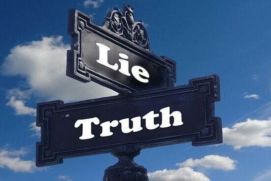 Truth & Lie A street sign with the words lie and truth perpendicular to each other