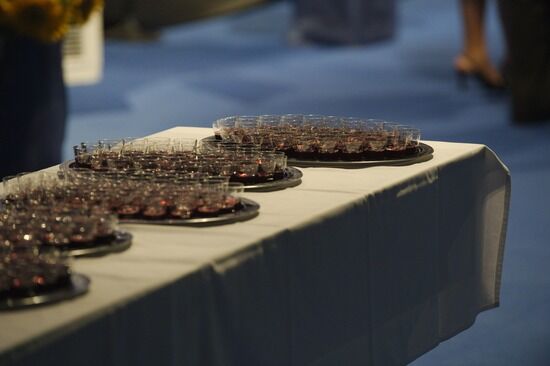 Communion cups on a table Trays with communion cups are sometimes laid out on a table before being served. They remind us of how Jesus shed His blood for us.