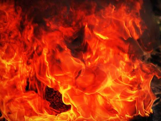 Flames from a fire Hot, orange flames.