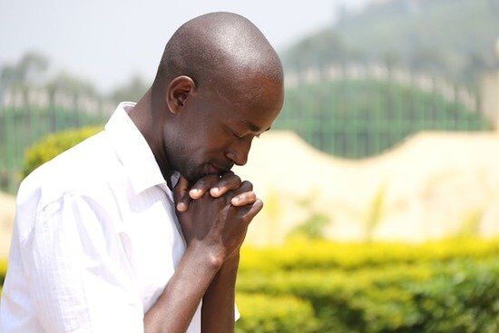 Man praying A man praying and submitting to God in a time of need