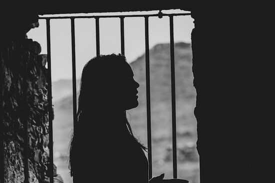 Women Believer Imprisoned A woman behind bars for her faith in God