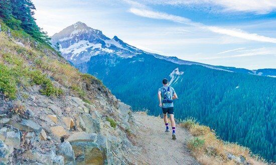 Man Running Up Mountain A man running in the mountains, living out the health counsels of Ellen White for the Adventist Church
