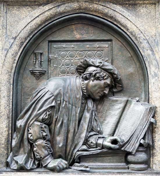 Martin Luther Statue With Bible A statue of Martin Luther with a Bible