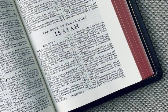 Bible open to the book of Isaiah A Bible open to the first chapter of the book of Isaiah